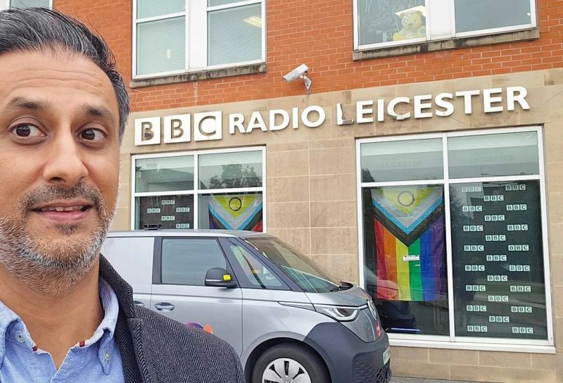 Vinny outside the BBC Radio Leicester building, with its sign visible behind him