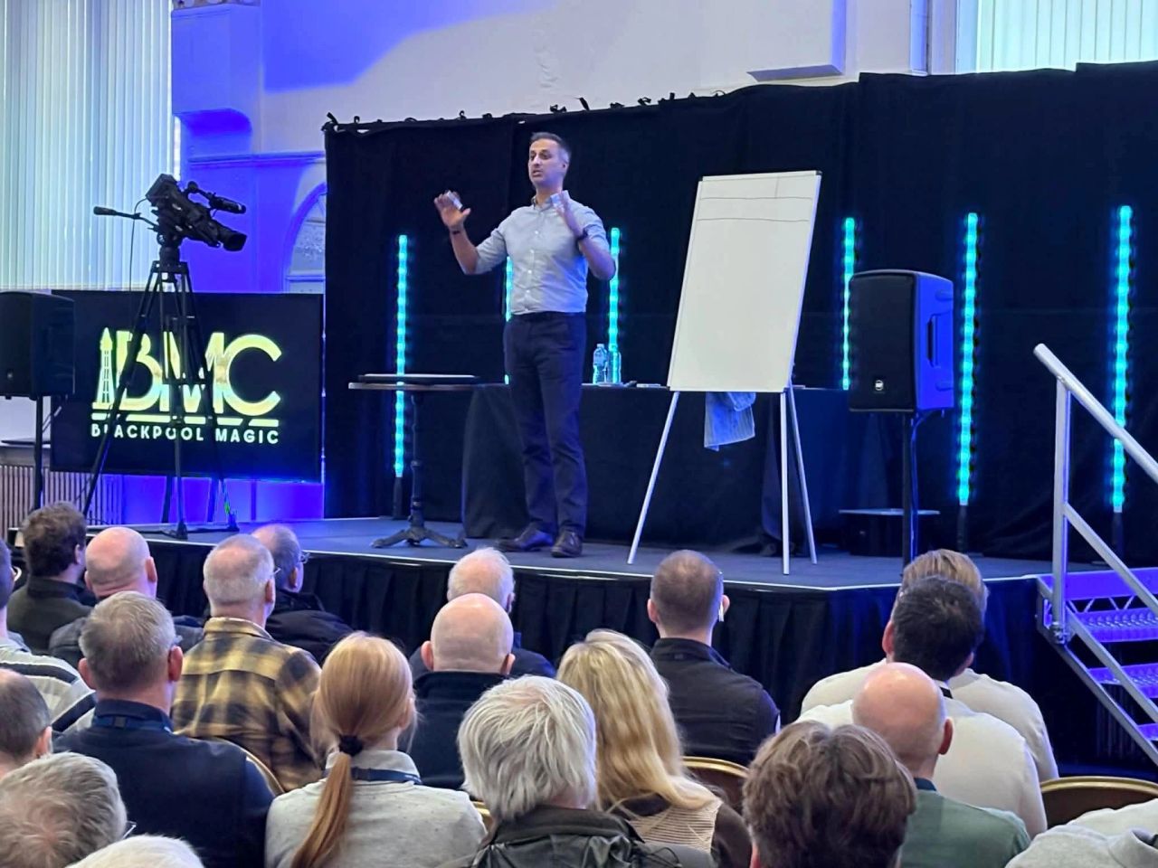 Vinny presenting on stage to an audience at Blackpool Magic Convention